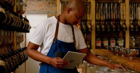 manager checking bar glasses